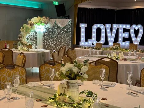 Decorated function room set up for a celebration at Poplar Social Club
