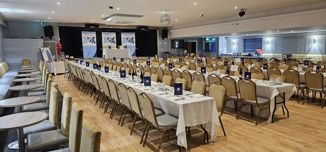 Large function room at Poplar Social Club set up for an evening event