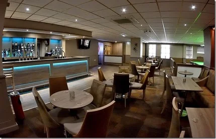 Modern bar and lounge seating area at Poplar Social Club