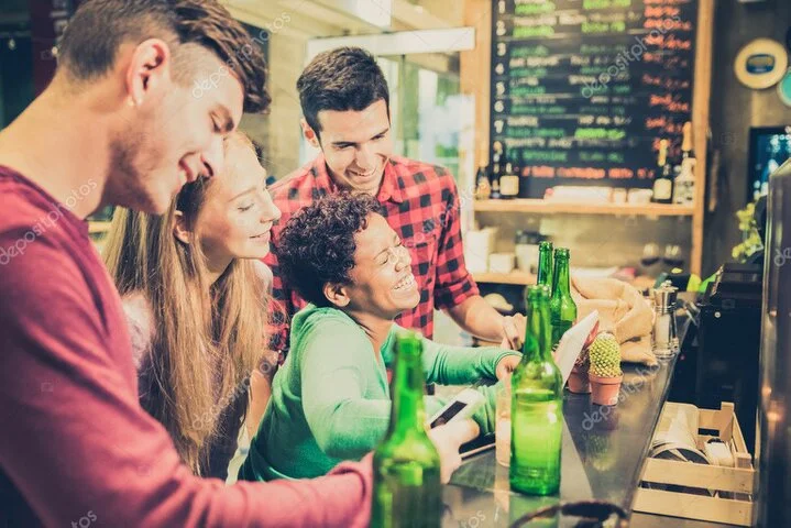 Friends laughing and cheering together on a club night