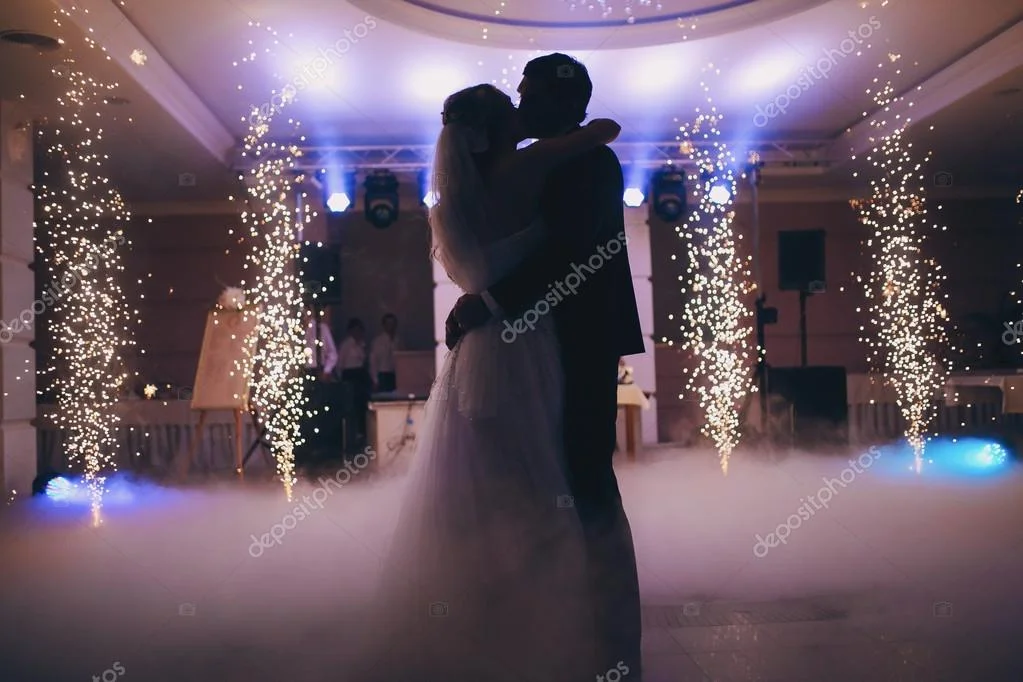 Wedding couple and guests dancing in the function room