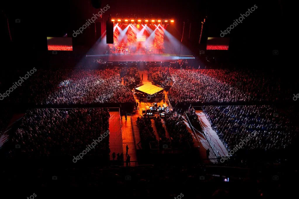 Live band performing on stage with people dancing